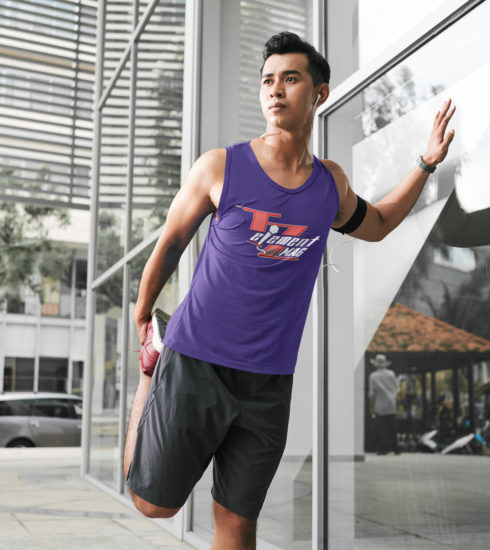 TZeMAG-tank-top-of-an-athlete-stretching-his-leg-before-running-through-the-city-remix1